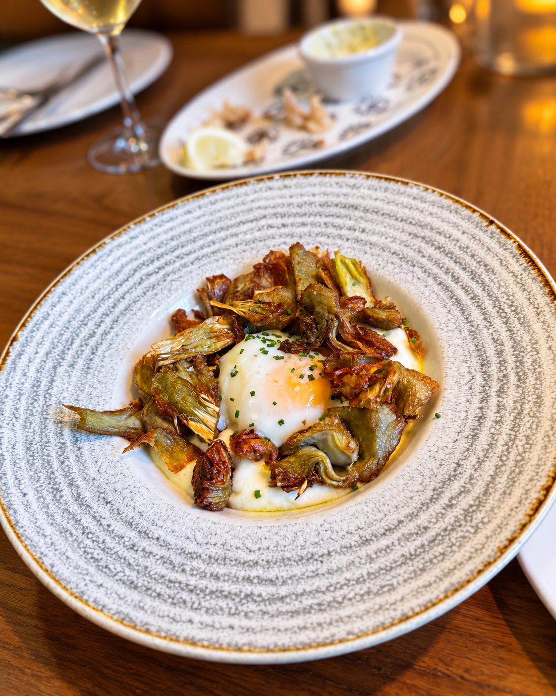 Crispy artichokes with slow-cooked egg on potato parmentier, Dining Door